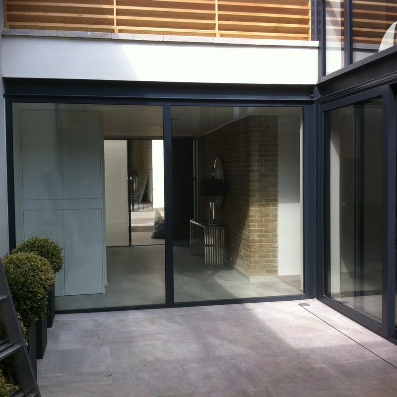 Floor-to-ceiling sliding doors opening to courtyard in Chelsea