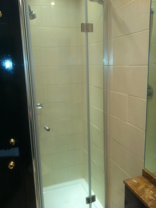Frameless glass shower enclosure with chrome fittings in Chelsea