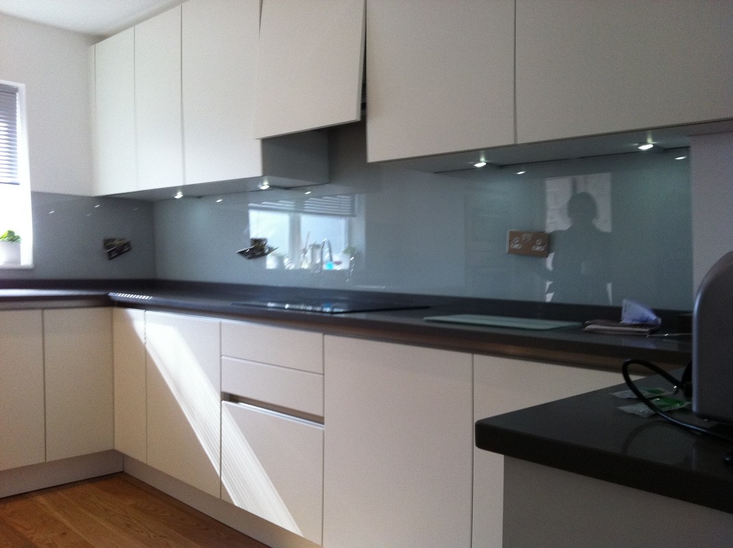 Grey glass kitchen splashback with LED lighting in Chelsea
