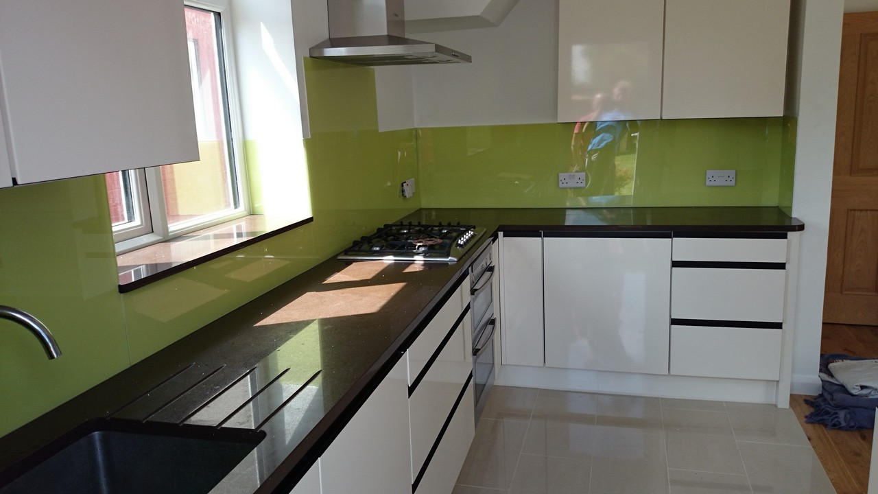 Lime green glass kitchen splashback installed by Chelsea glaziers