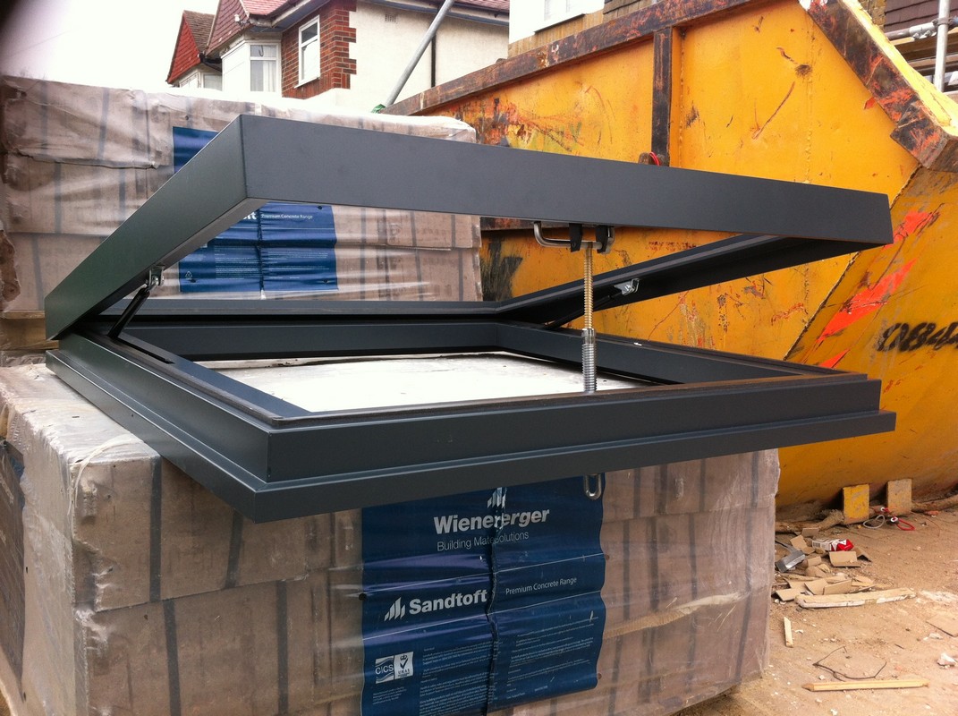 Opening flat roof skylight in anthracite grey installed in Chelsea
